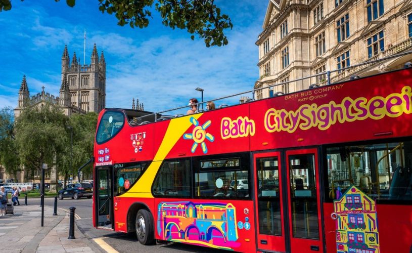 A red Bath City Sightseeing Bus